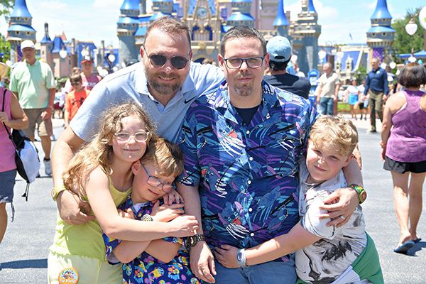 Two dads and kids at Disney